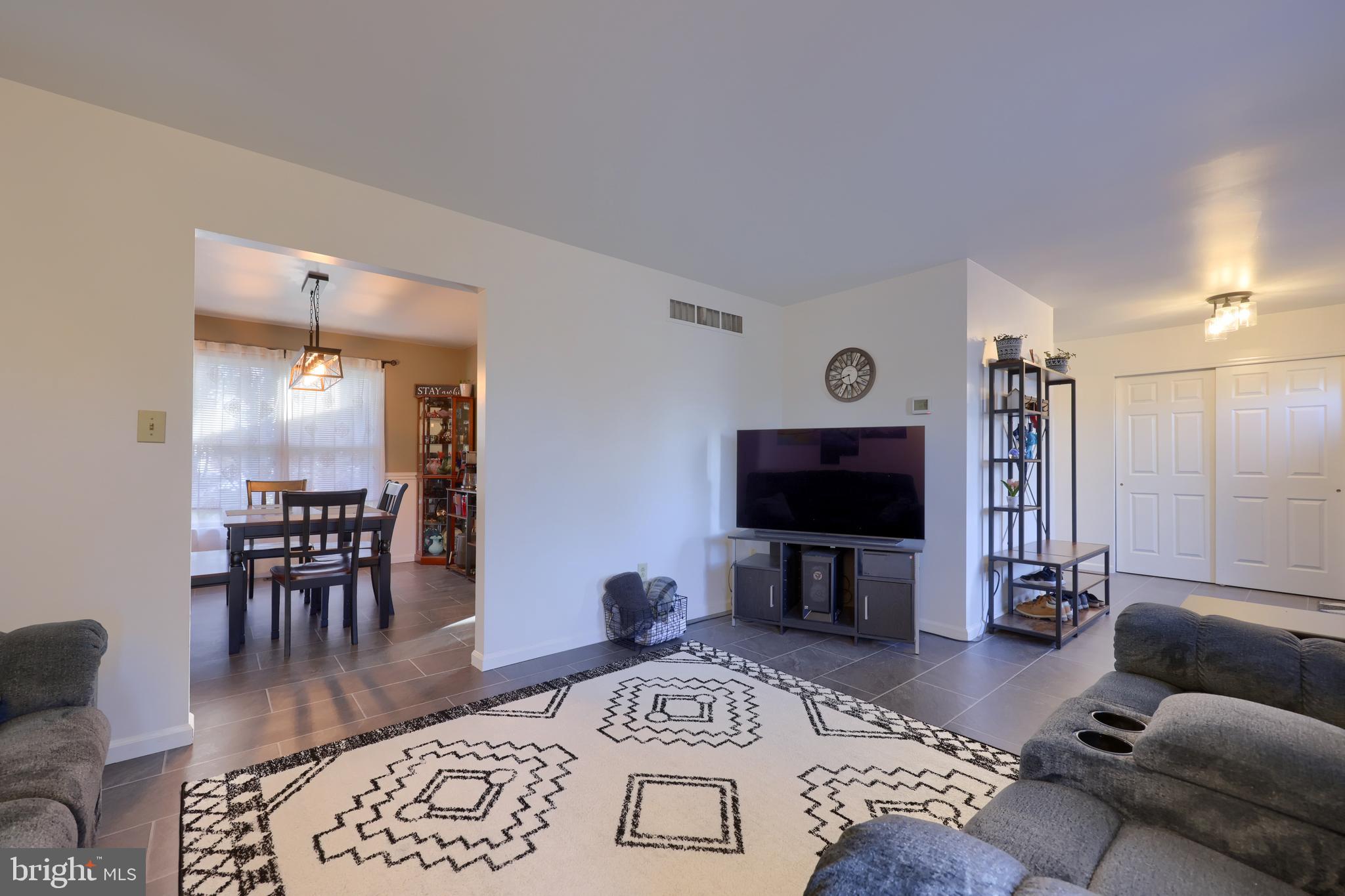 1022 Boeshore Circle Reading, PA 19605 - Photo 10 of 39 a living room with furniture and a flat screen tv