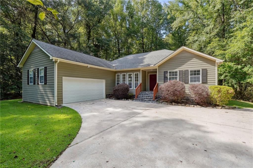 120 Huntingdon Court Tyrone, GA 30290 - Photo 1 of 1 a view of a house with a yard and large tree