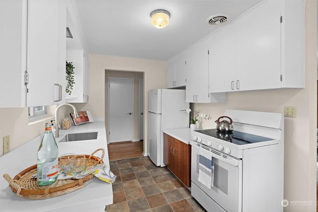 a kitchen with a sink and cabinets