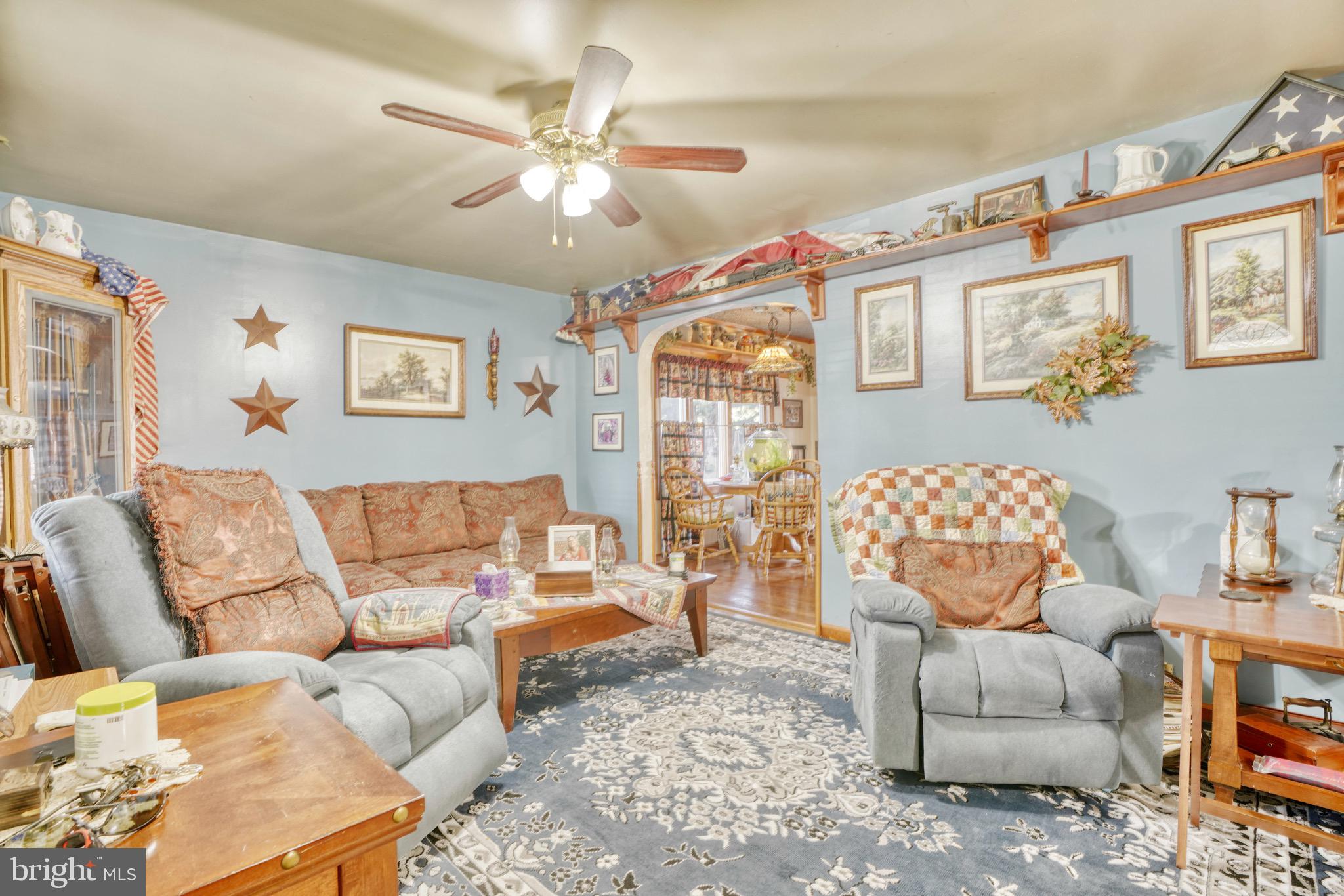 1903 Adams Road Baltimore, MD 21222 - Photo 5 of 29 a living room with furniture and a large window