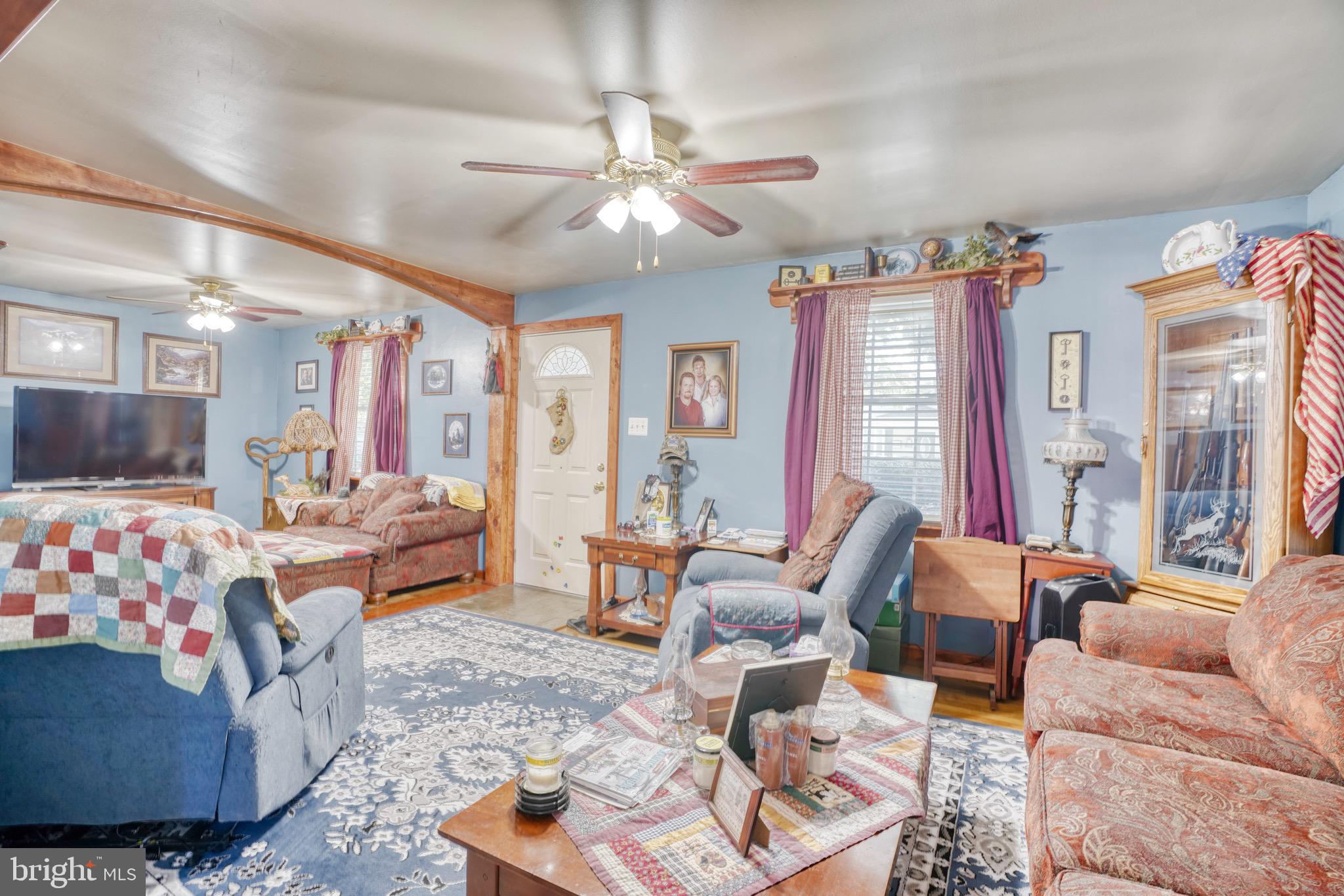 1903 Adams Road Baltimore, MD 21222 - Photo 6 of 29 a living room with furniture and a large window
