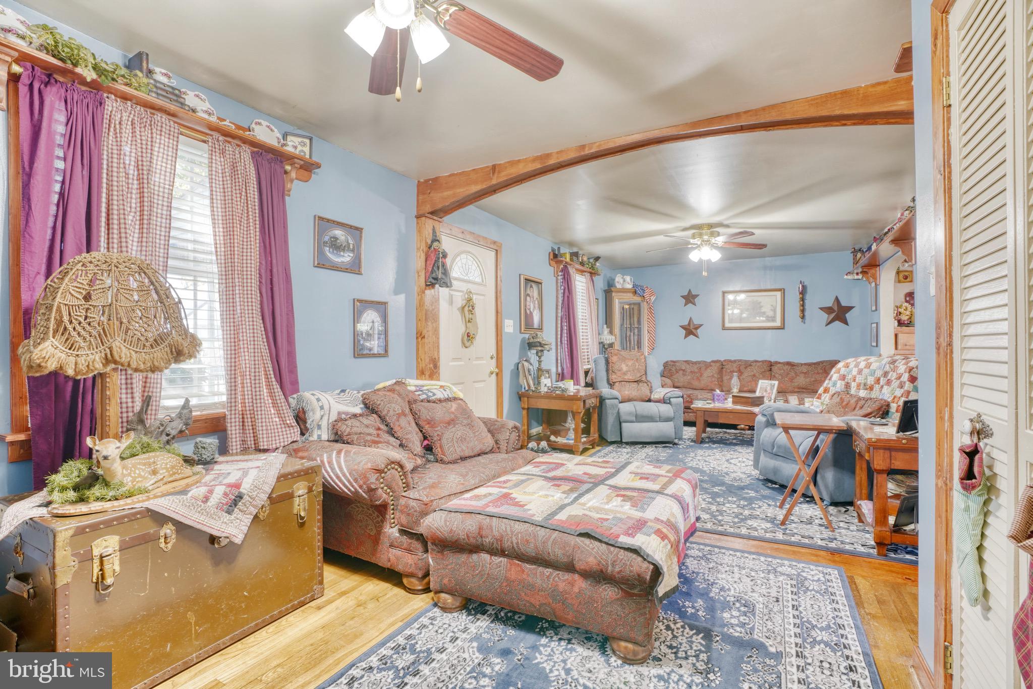 1903 Adams Road Baltimore, MD 21222 - Photo 7 of 29 a living room with furniture and a chandelier