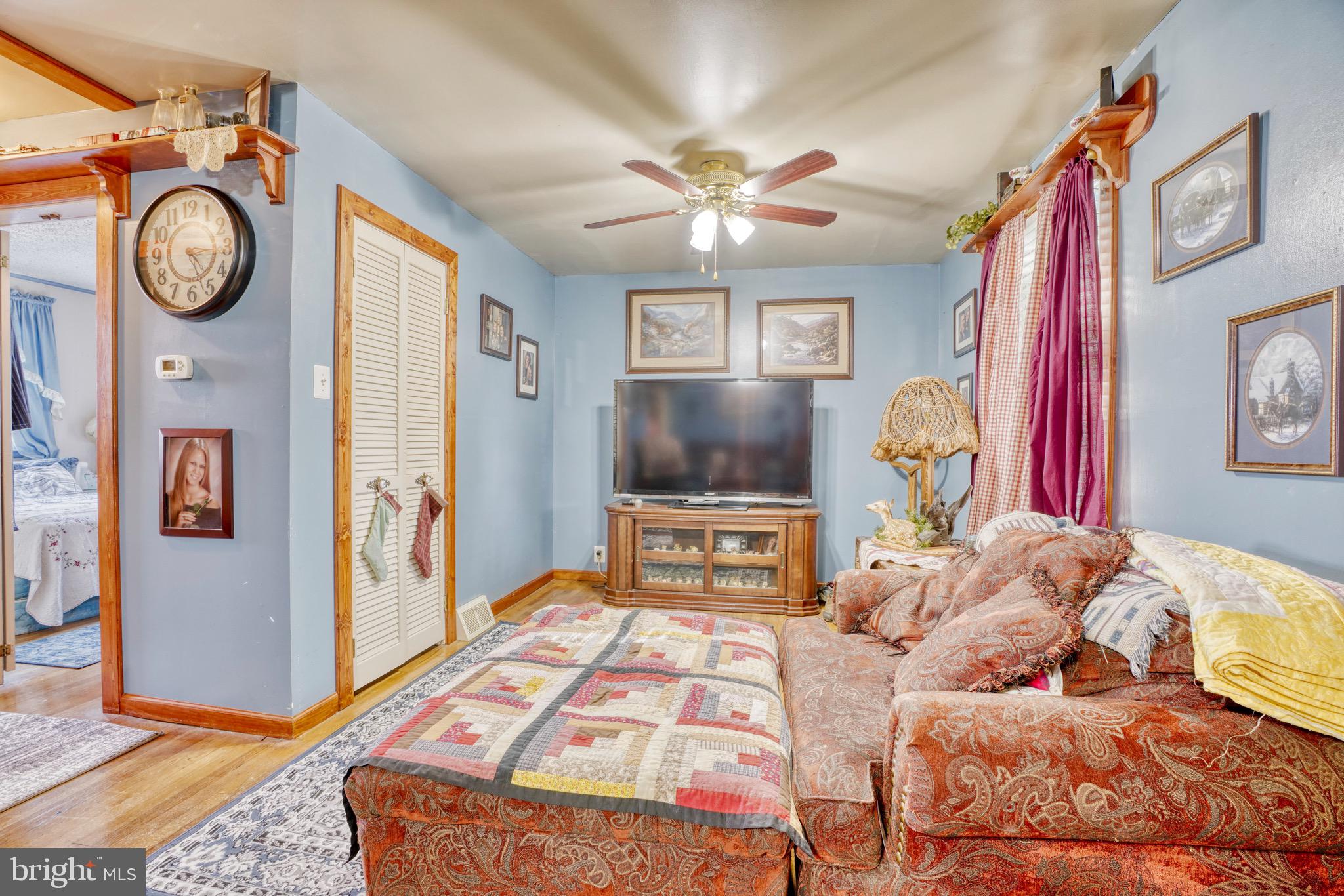 1903 Adams Road Baltimore, MD 21222 - Photo 8 of 29 a bedroom with a bed and a chandelier