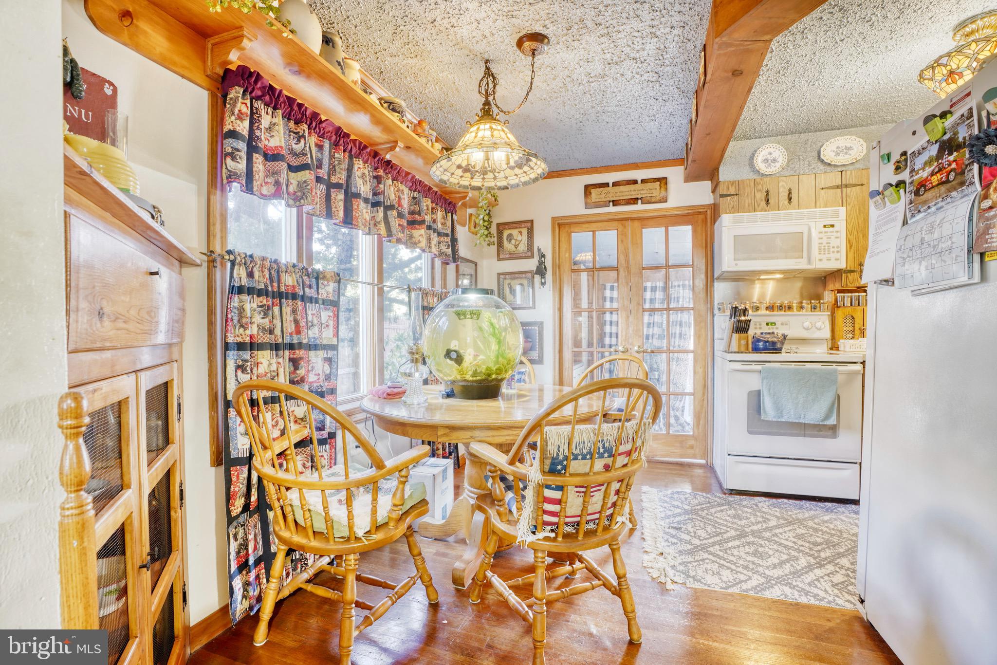 1903 Adams Road Baltimore, MD 21222 - Photo 9 of 29 a view of a dining room with furniture and chandelier
