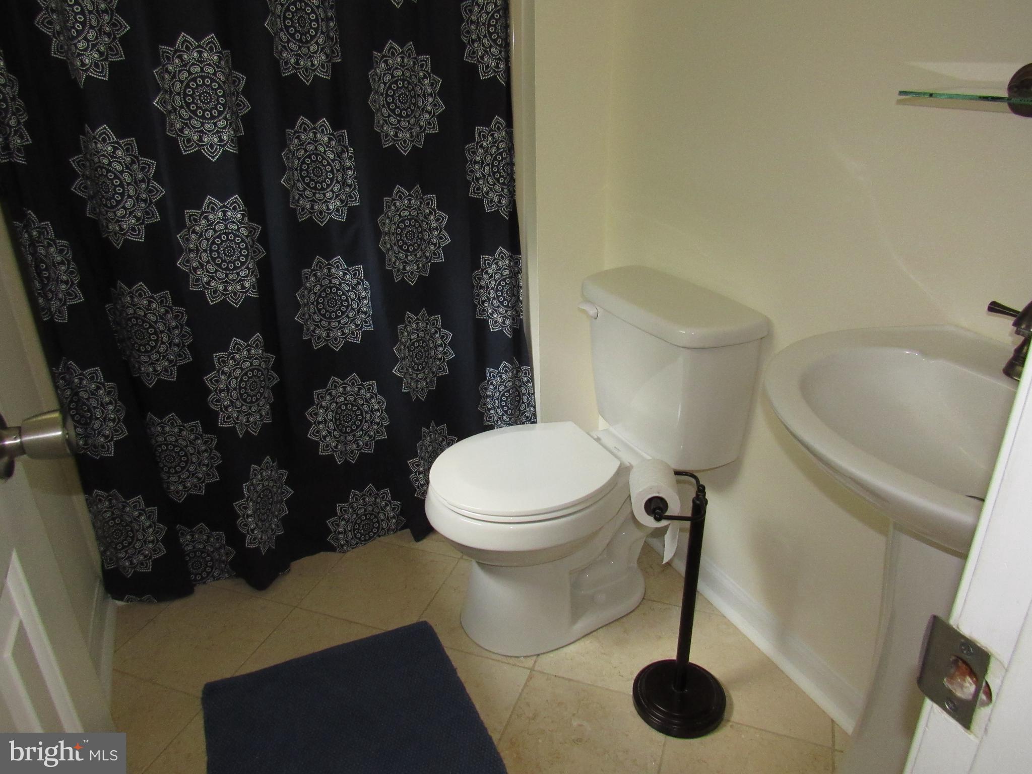 3235 Richfield Road Huntingtown, MD 20639 - Photo 38 of 64 a bathroom with a toilet and a shower