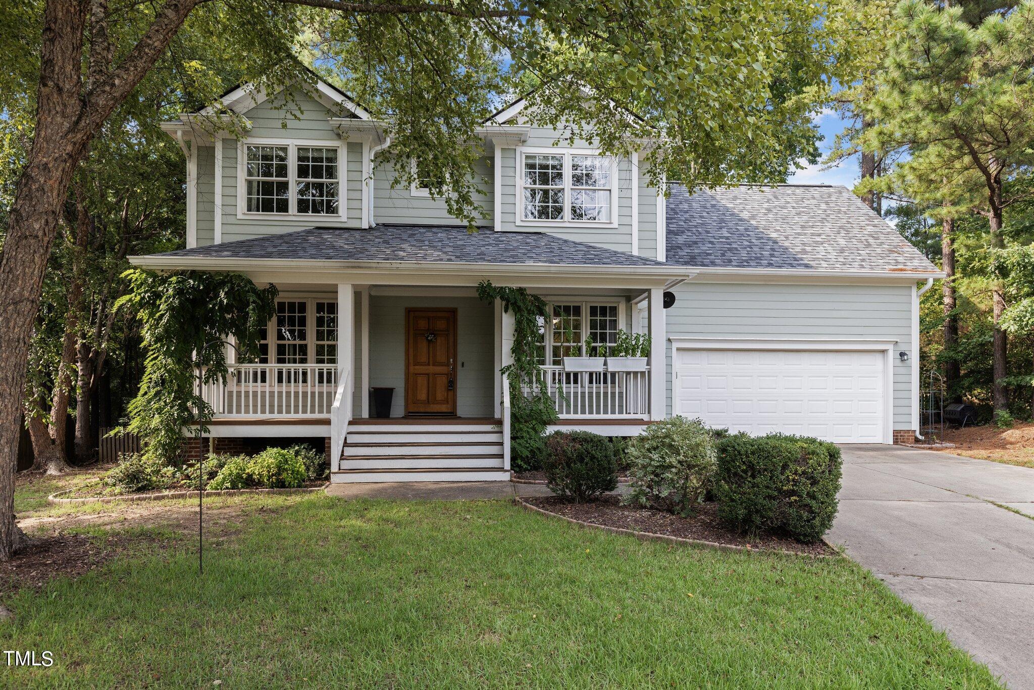 1015 Daresbury Drive Apex, NC 27502 - Photo 1 of 50 a view of a house with a garden