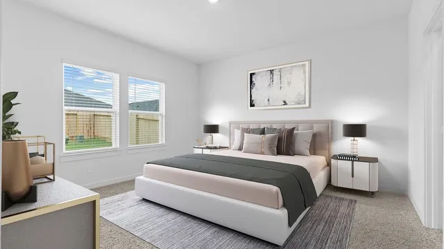 a spacious bedroom with a bed and a couch