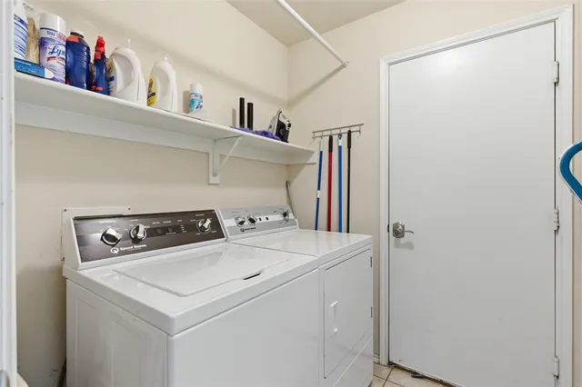 a utility room with dryer and washer