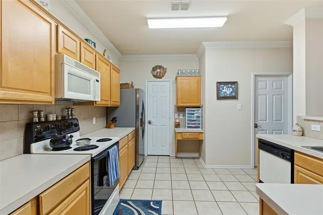 a kitchen with a sink a stove and refrigerator