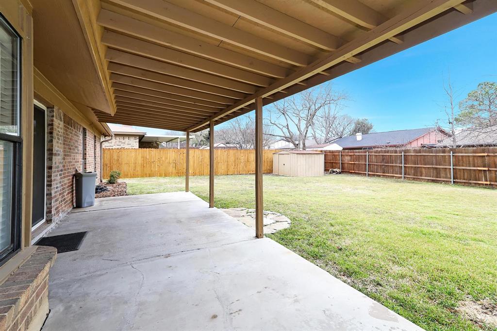 6632 Valley View Drive Watauga, TX 76148 - Photo 17 of 18 a view of a backyard of a house