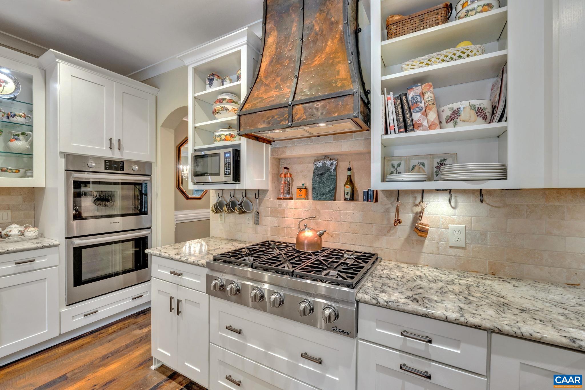 803 Rugby Road Charlottesville, VA 22903 - Photo 8 of 74 a kitchen with stainless steel appliances granite countertop a stove and a microwave
