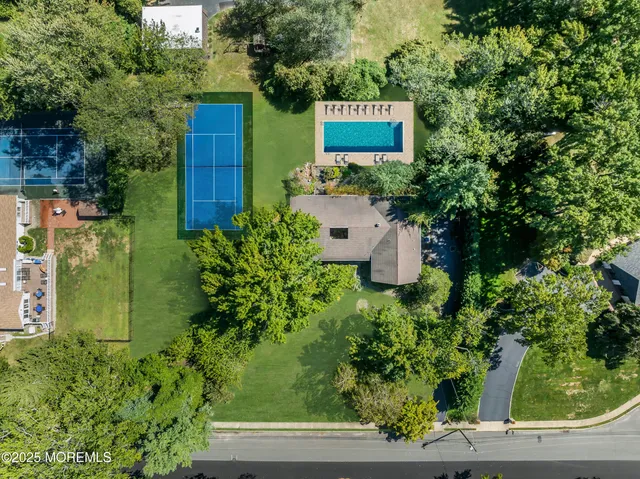 a sign that is sitting in front of flowers