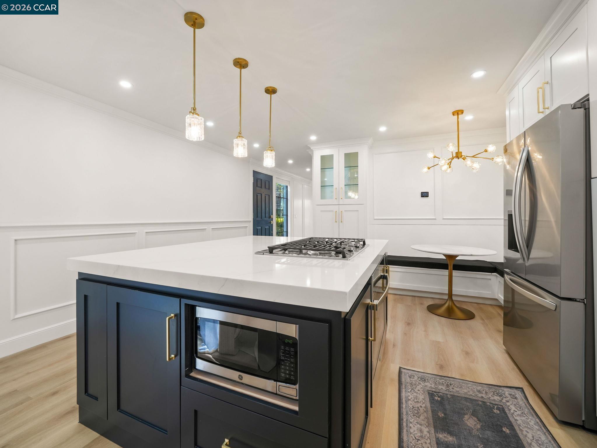 1622 San Luis Road Walnut Creek, CA 94597 - Photo 11 of 29 a kitchen with a sink a refrigerator and a stove