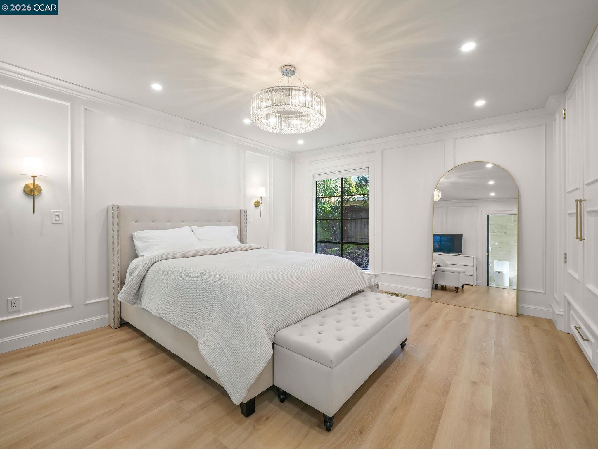 1622 San Luis Road Walnut Creek, CA 94597 - Photo 15 of 29 a bedroom with a large bed and a chandelier