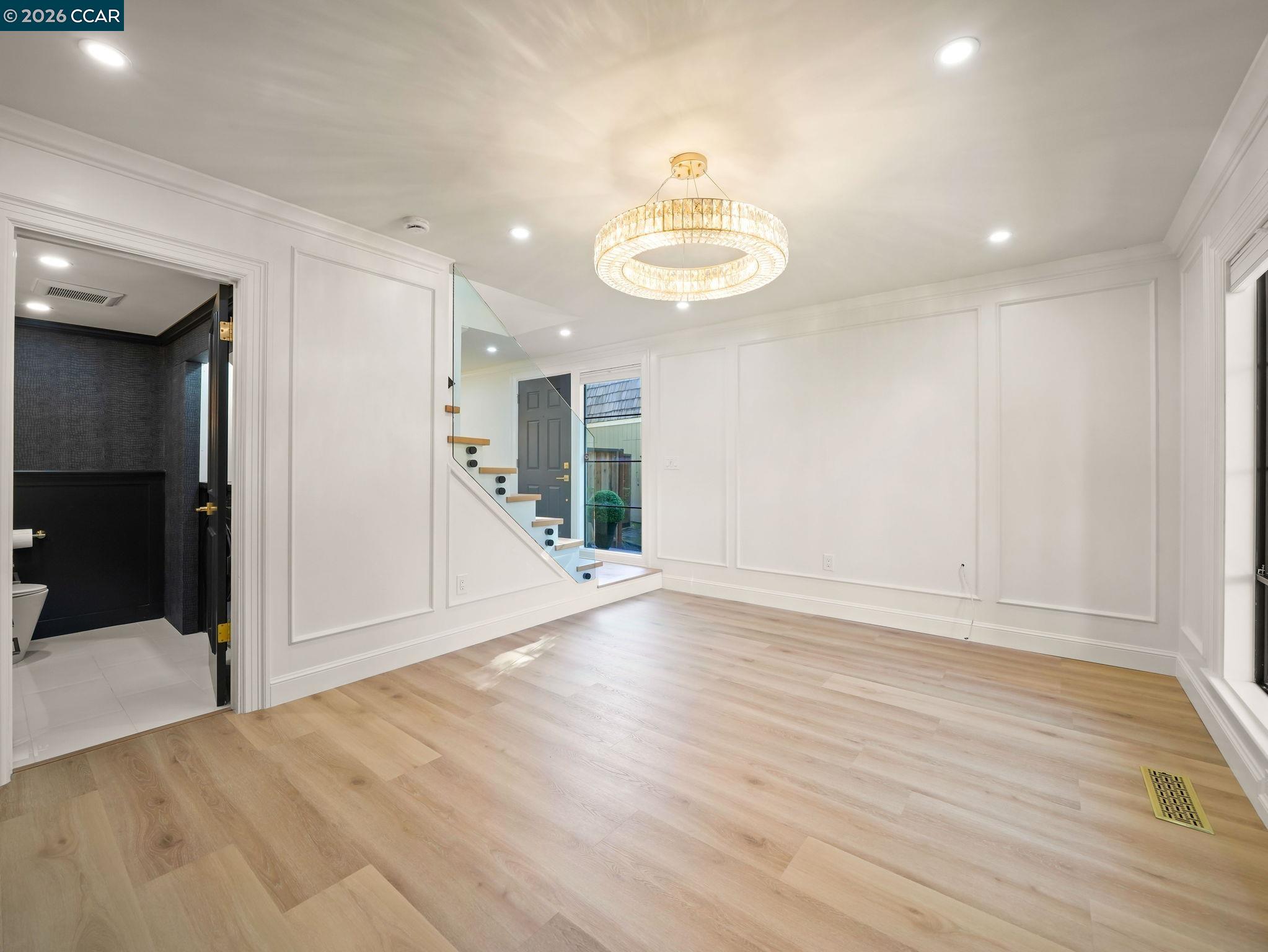 1622 San Luis Road Walnut Creek, CA 94597 - Photo 6 of 29 a view of an empty room with wooden floor and staircase