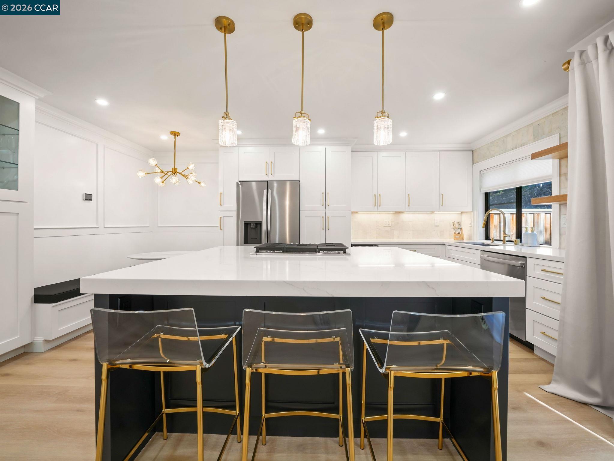 1622 San Luis Road Walnut Creek, CA 94597 - Photo 9 of 29 a kitchen with kitchen island white cabinets and wooden floor