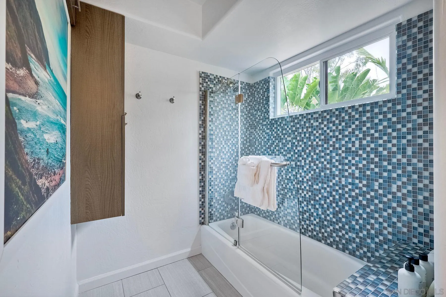 1408 Caudor Street Encinitas, CA 92024 - Photo 28 of 75 a bathroom with a shower curtain and a sink