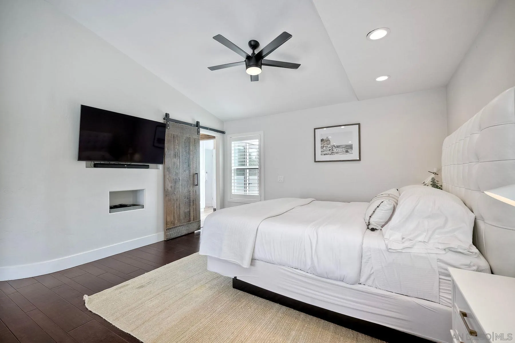 1408 Caudor Street Encinitas, CA 92024 - Photo 32 of 75 a bedroom with a large bed and a flat screen tv