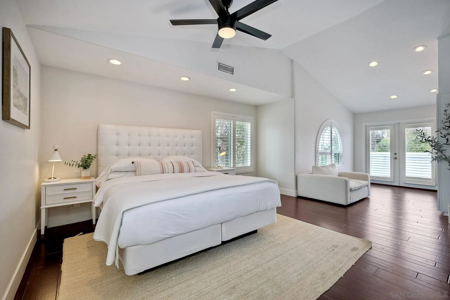 1408 Caudor Street Encinitas, CA 92024 - Photo 33 of 75 a spacious bedroom with a large bed and windows