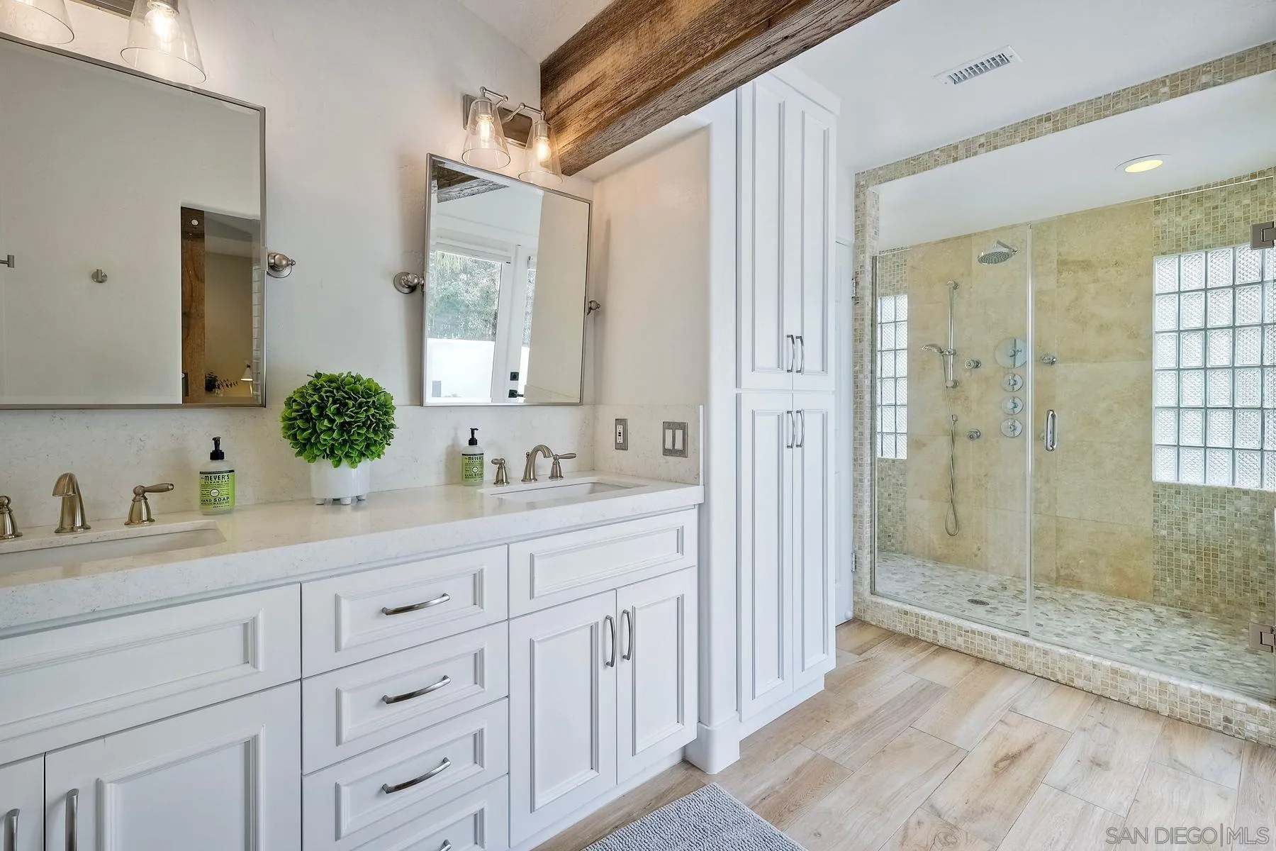 1408 Caudor Street Encinitas, CA 92024 - Photo 34 of 75 a bathroom with a double vanity sink mirror and shower