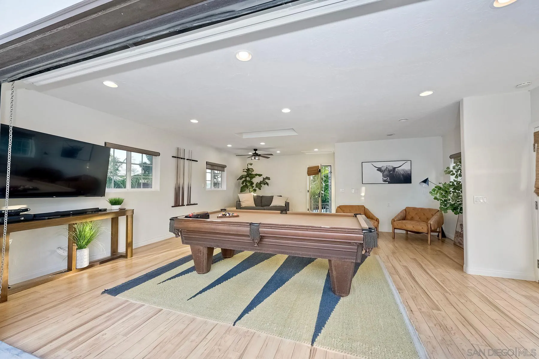 1408 Caudor Street Encinitas, CA 92024 - Photo 39 of 75 a living room with furniture and a flat screen tv