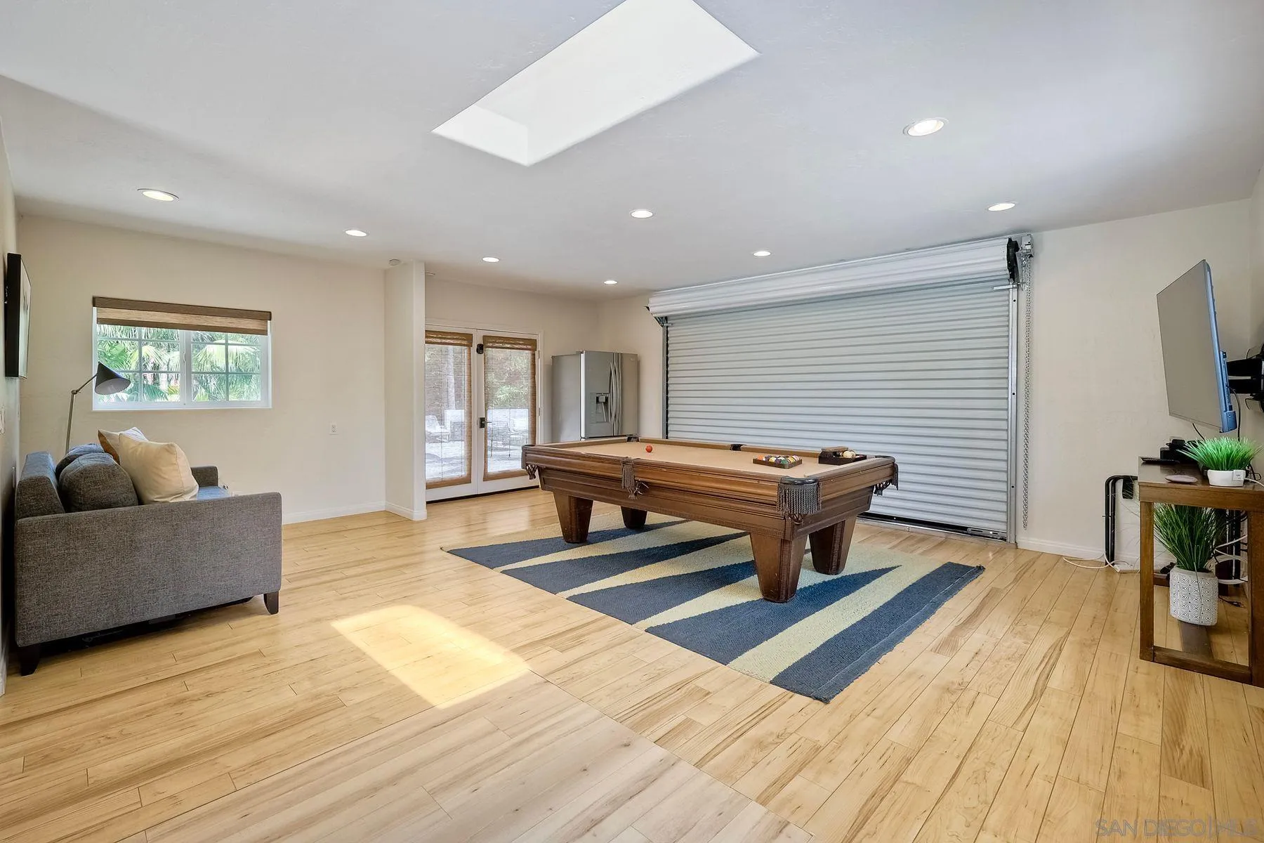 1408 Caudor Street Encinitas, CA 92024 - Photo 40 of 75 a living room with furniture a wooden floor and potted plant