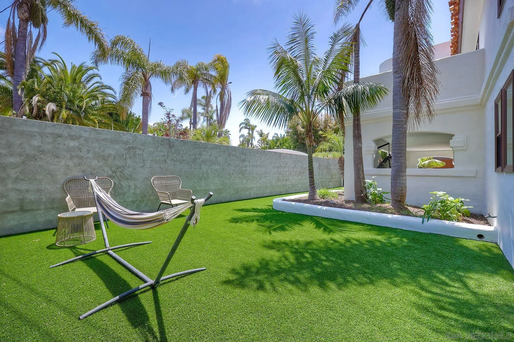 1408 Caudor Street Encinitas, CA 92024 - Photo 52 of 75 a view of a chair and table in the garden