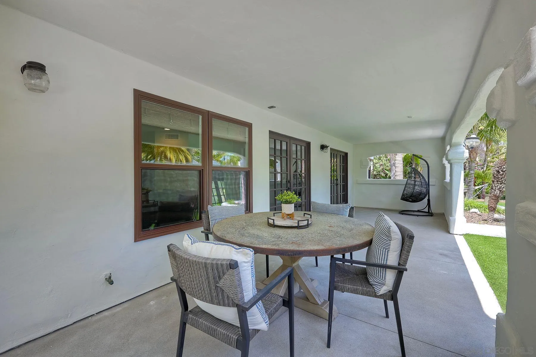 1408 Caudor Street Encinitas, CA 92024 - Photo 53 of 75 a view of a dining room with furniture wooden floor and a chandelier