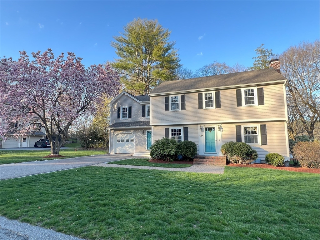 85 Blake Road Lexington, MA 02420 - Photo 2 of 42 a front view of house with yard and green space