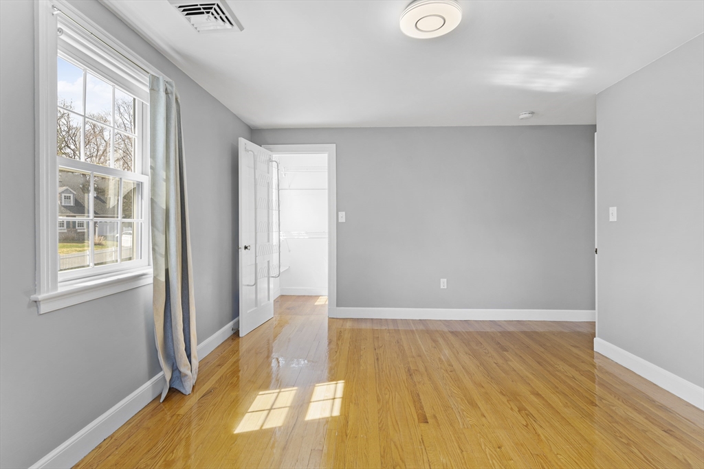 85 Blake Road Lexington, MA 02420 - Photo 32 of 42 a view of an empty room with wooden floor and a window