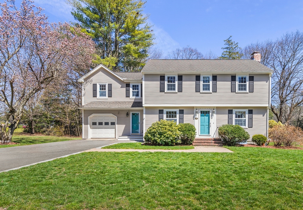 85 Blake Road Lexington, MA 02420 - Photo 40 of 42 a front view of a house with a yard and trees