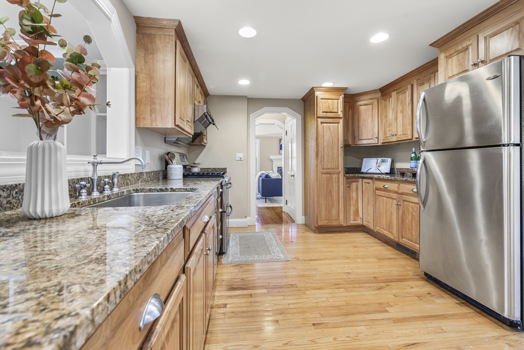 85 Blake Road Lexington, MA 02420 - Photo 10 of 42 a kitchen with stainless steel appliances granite countertop a refrigerator a sink and a stove