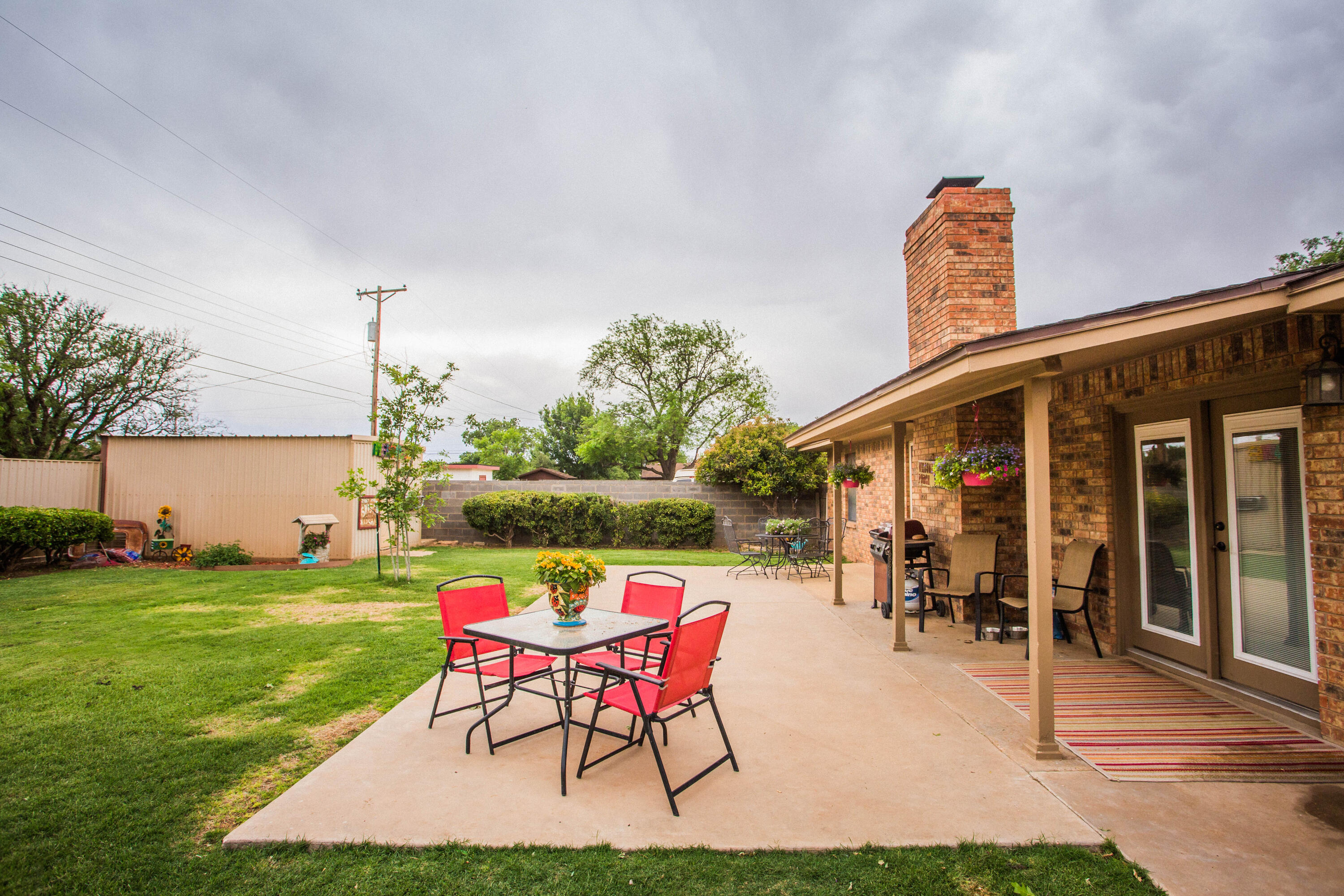 1304 Jefferson Drive Plainview, TX 79072 - Photo 45 of 50 a patio with garden area and outdoor seating