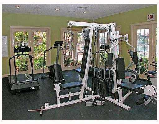 3874 Lyons Road, Unit 3026 Coconut Creek, FL 33073 - Photo 4 of 5 a view of a room with gym equipment