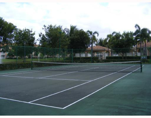 3874 Lyons Road, Unit 3026 Coconut Creek, FL 33073 - Photo 5 of 5 a view of a tennis court