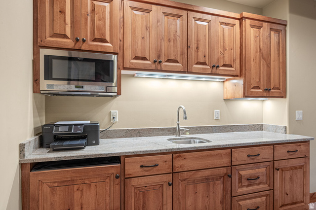 2331 West Entrada Trail, Unit 61 St. George, UT 84770 - Photo 38 of 69 Built-in stainless steel microwave over light-toned wood cabinetry