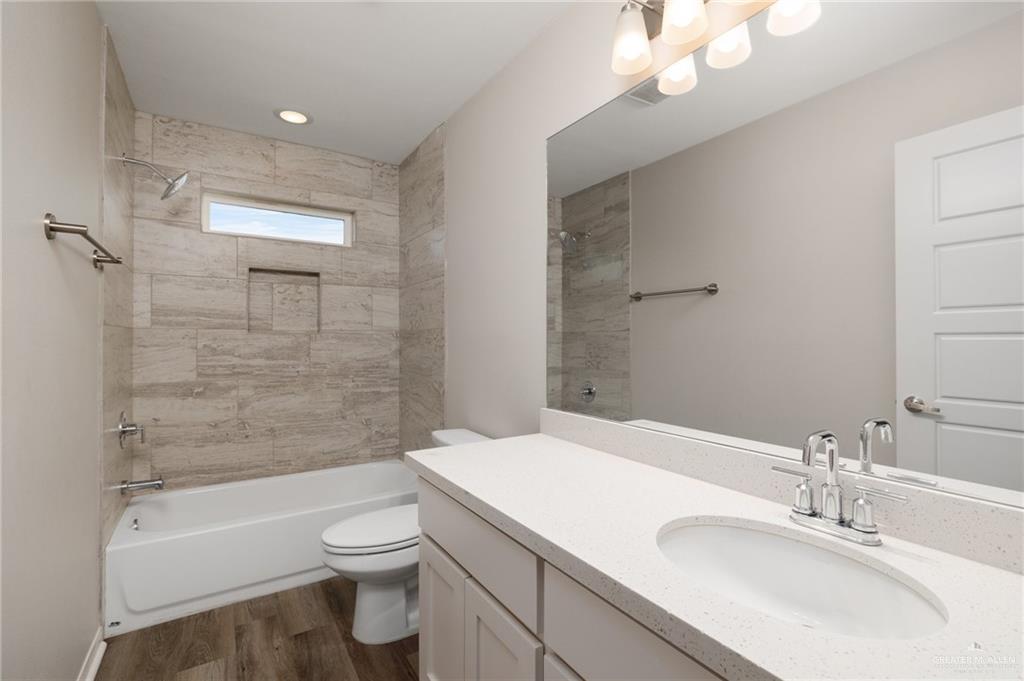 14325 Chalk Rdg Drive McAllen, TX 78504 - Photo 9 of 17 a bathroom with a sink a toilet and shower