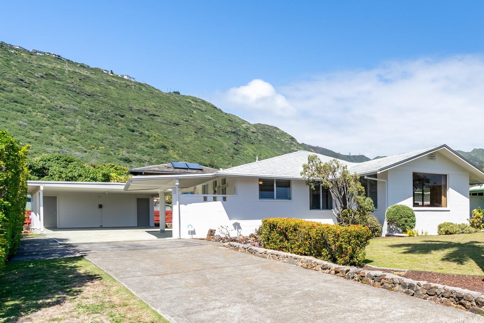 549 West Hind Drive Honolulu, HI 96821 - Photo 1 of 1 a front view of a house with a yard and garage