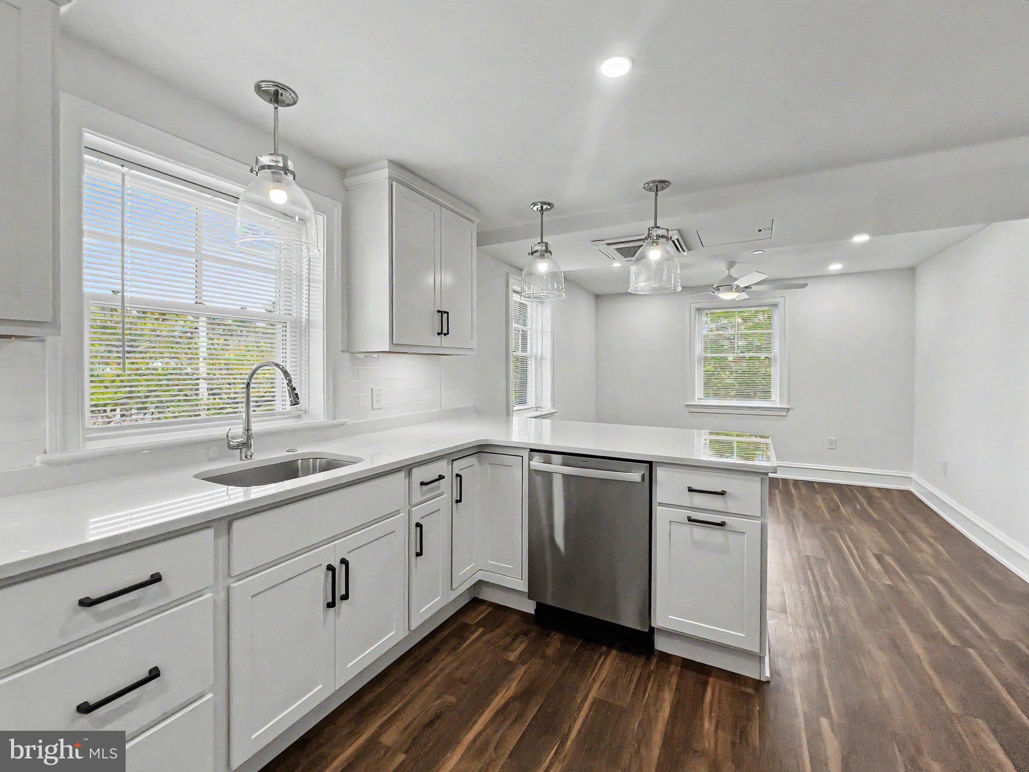 1 Pennsylvania Avenue, Unit 1 Wayne, PA 19087 - Photo 11 of 22 a kitchen with a sink window and cabinets
