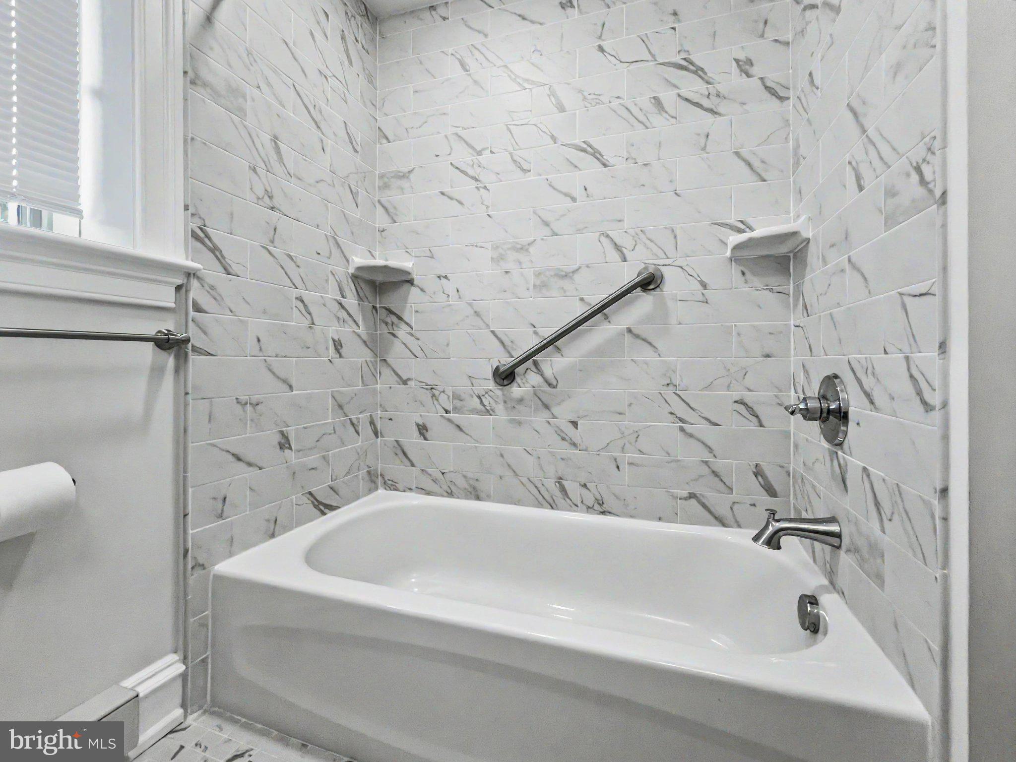 1 Pennsylvania Avenue, Unit 1 Wayne, PA 19087 - Photo 15 of 22 a bathroom with a bathtub