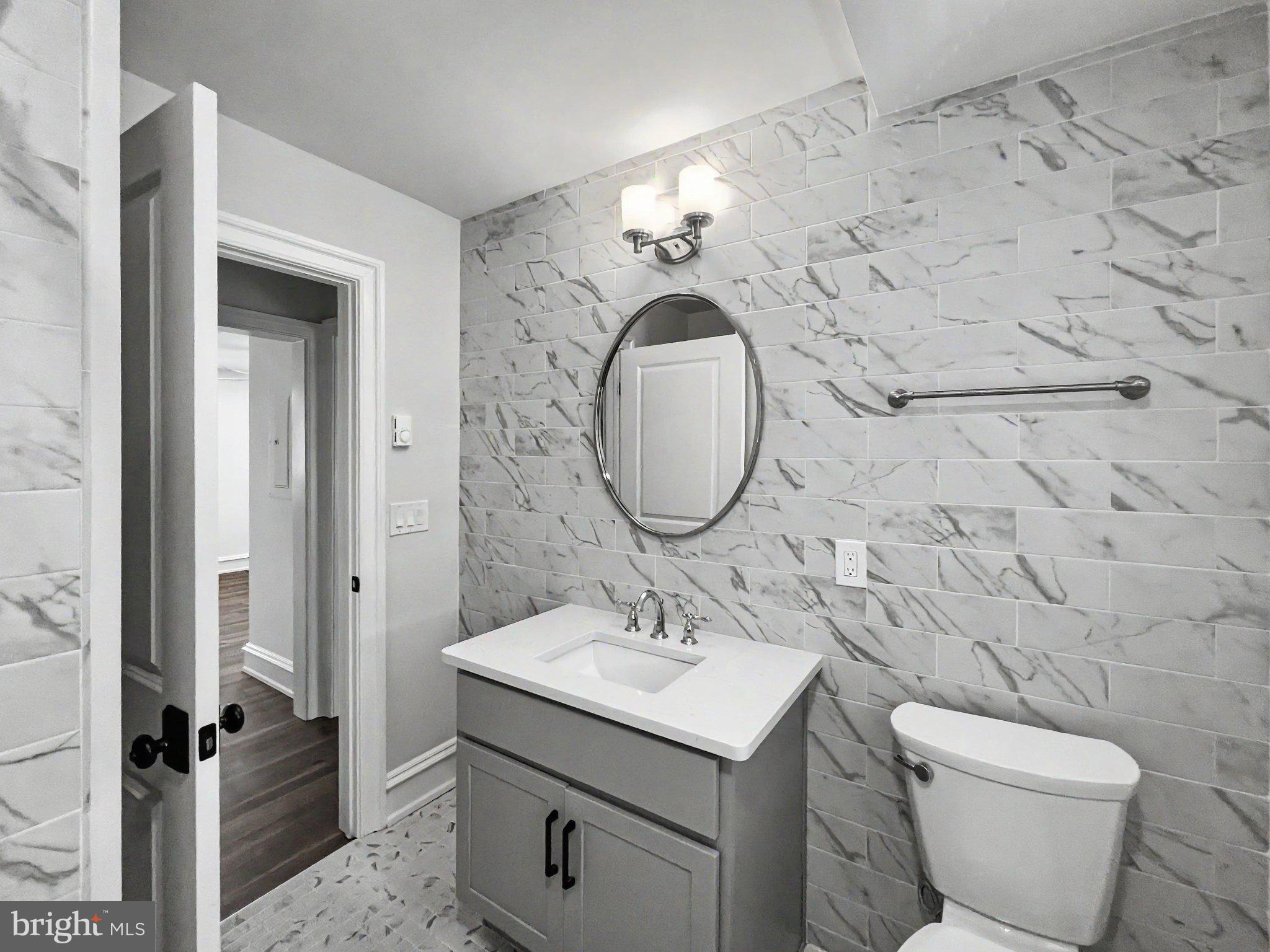 1 Pennsylvania Avenue, Unit 1 Wayne, PA 19087 - Photo 16 of 22 a bathroom with a sink toilet and shower