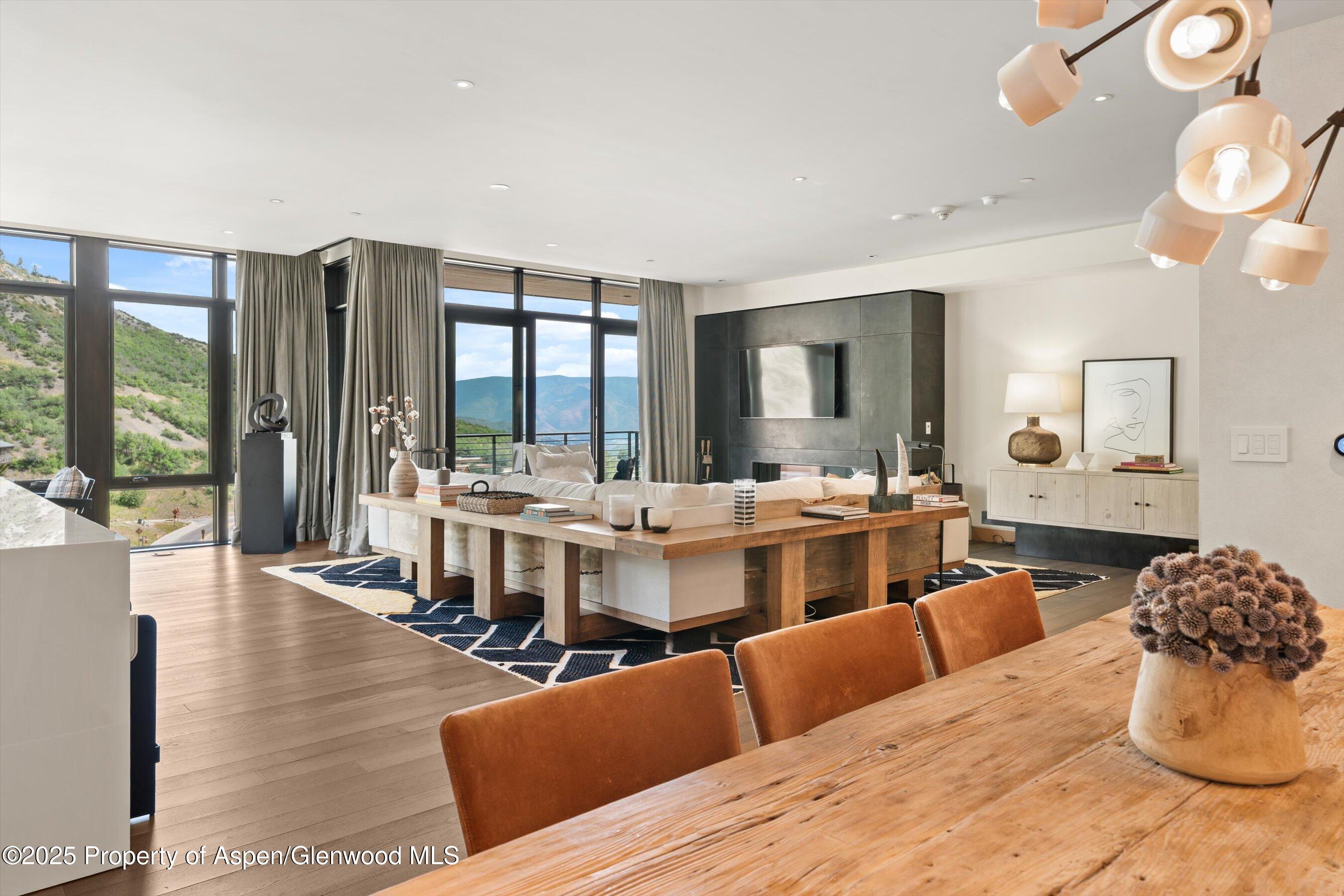45 Wood Road, Unit 501 Snowmass Village, CO 81615 - Photo 15 of 44 a living room with furniture and a large window