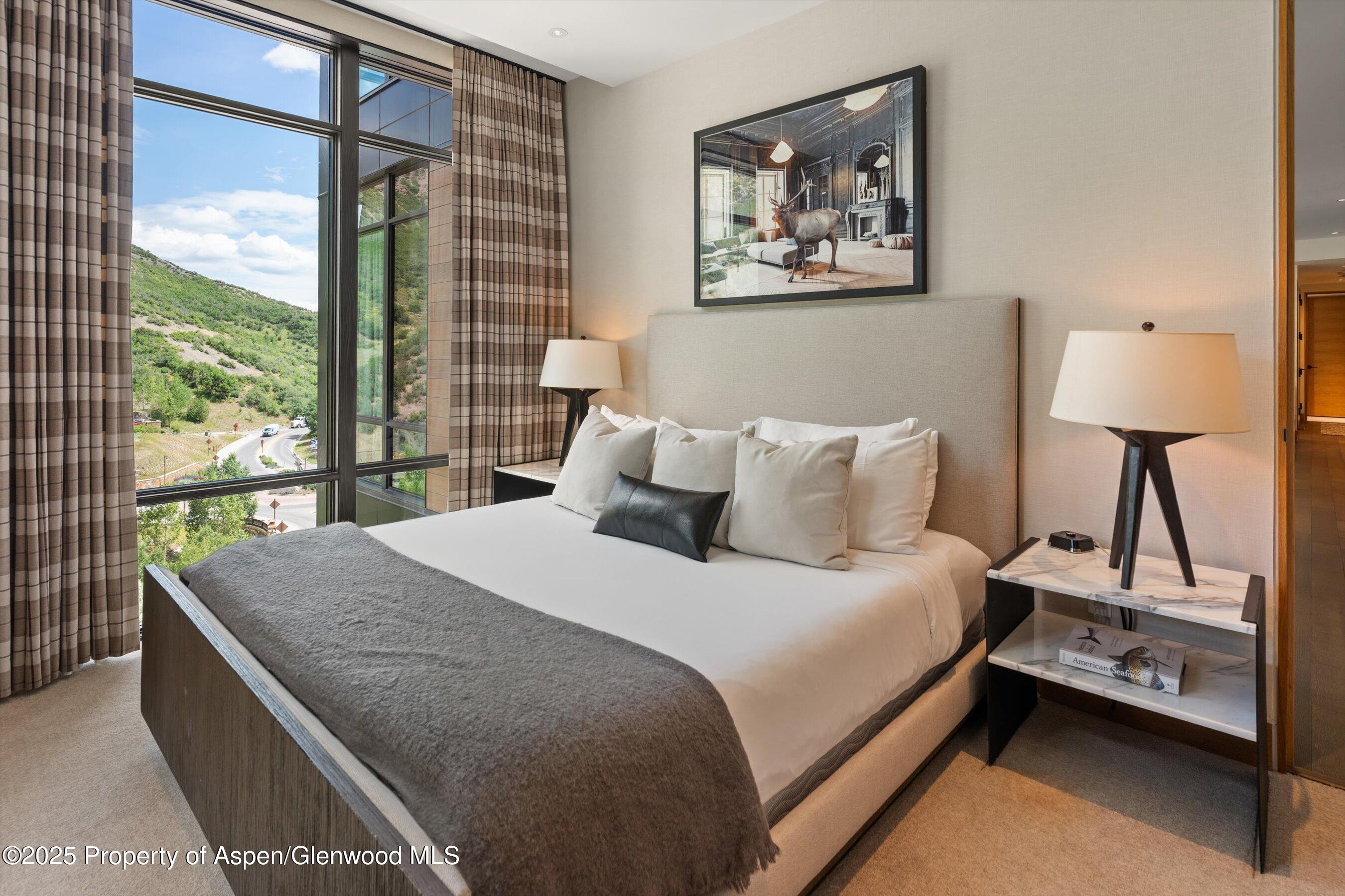 45 Wood Road, Unit 501 Snowmass Village, CO 81615 - Photo 24 of 44 a bedroom with a bed and a window