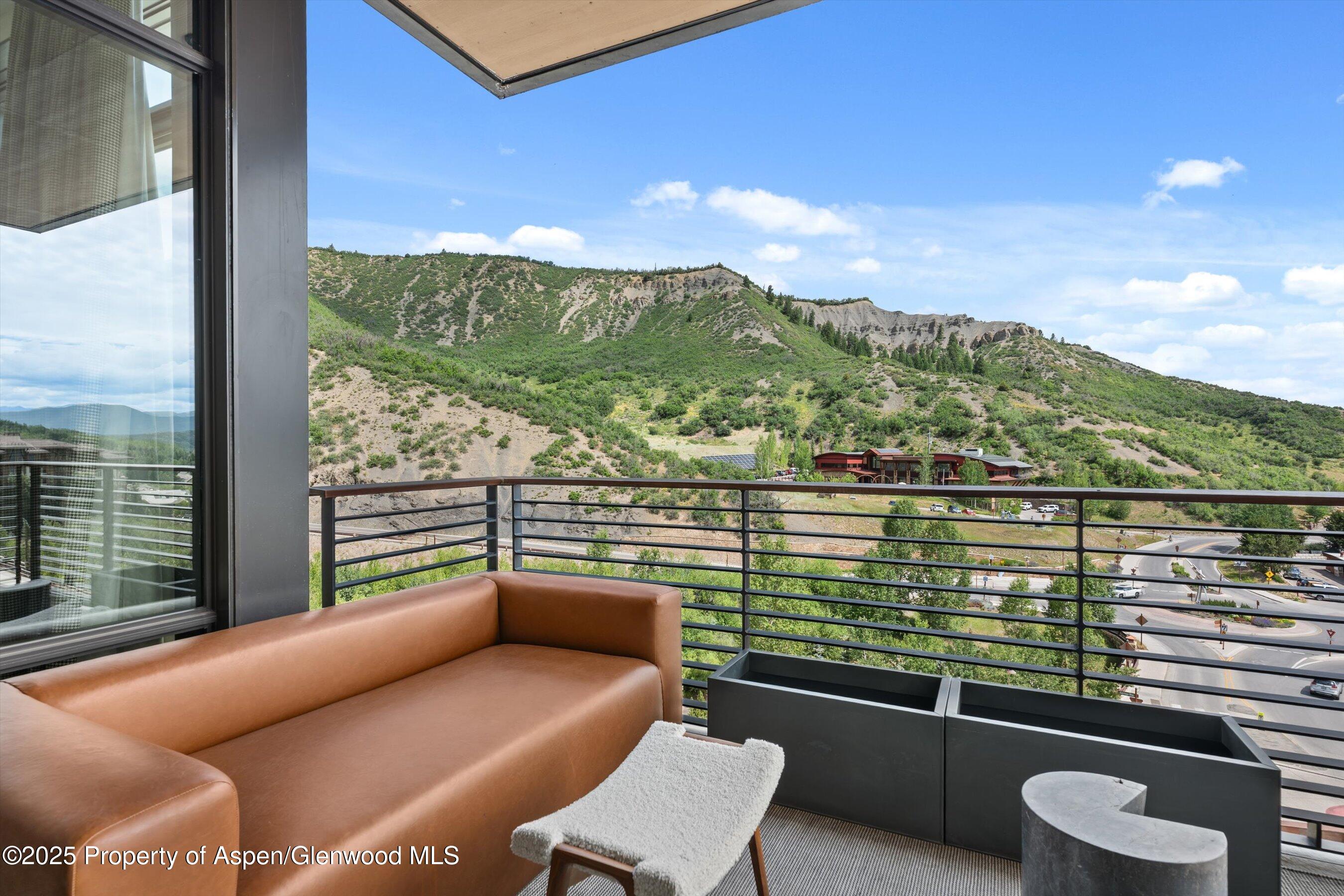45 Wood Road, Unit 501 Snowmass Village, CO 81615 - Photo 7 of 44 a view of a city from a balcony with furniture