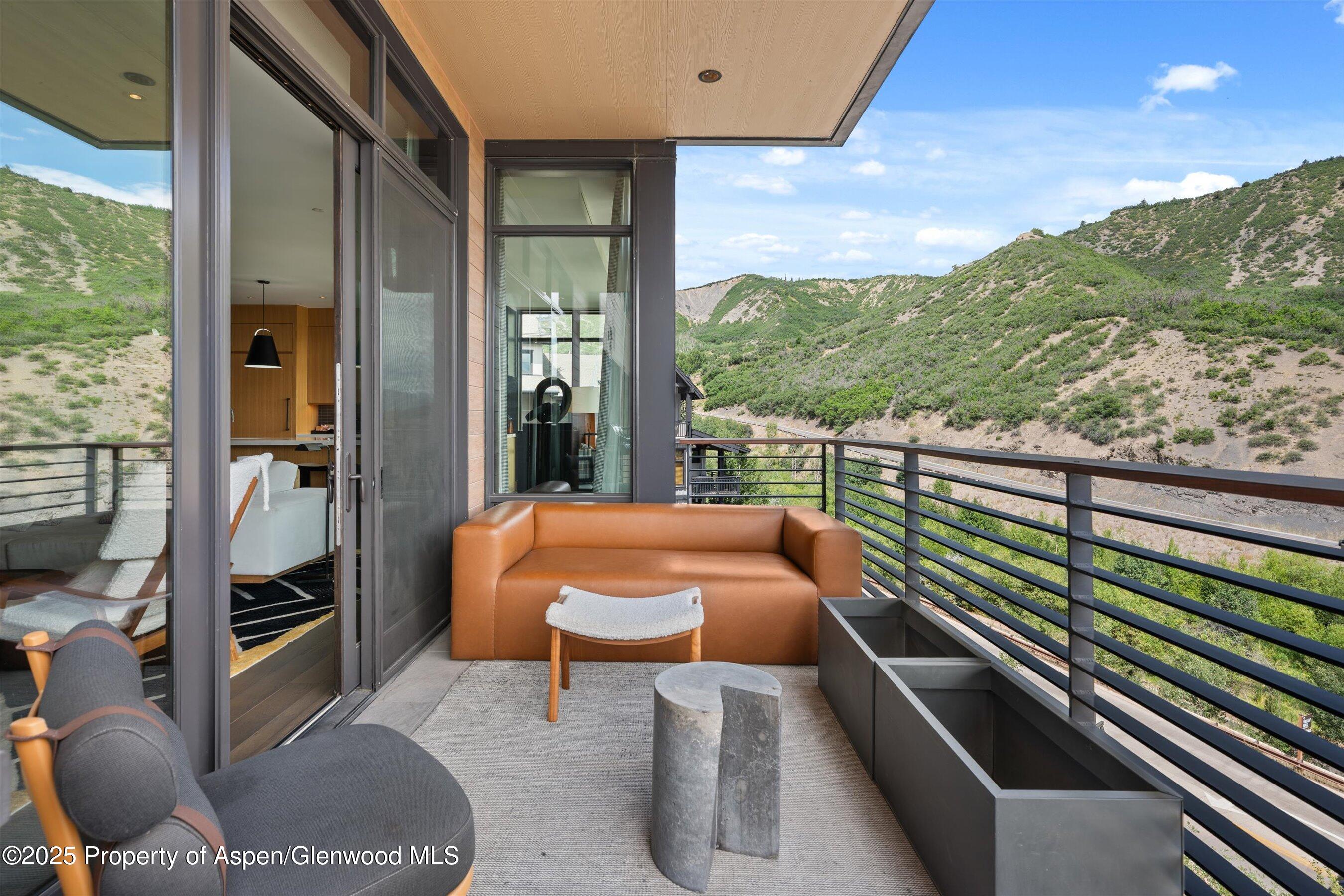 45 Wood Road, Unit 501 Snowmass Village, CO 81615 - Photo 8 of 44 a view of balcony with chairs
