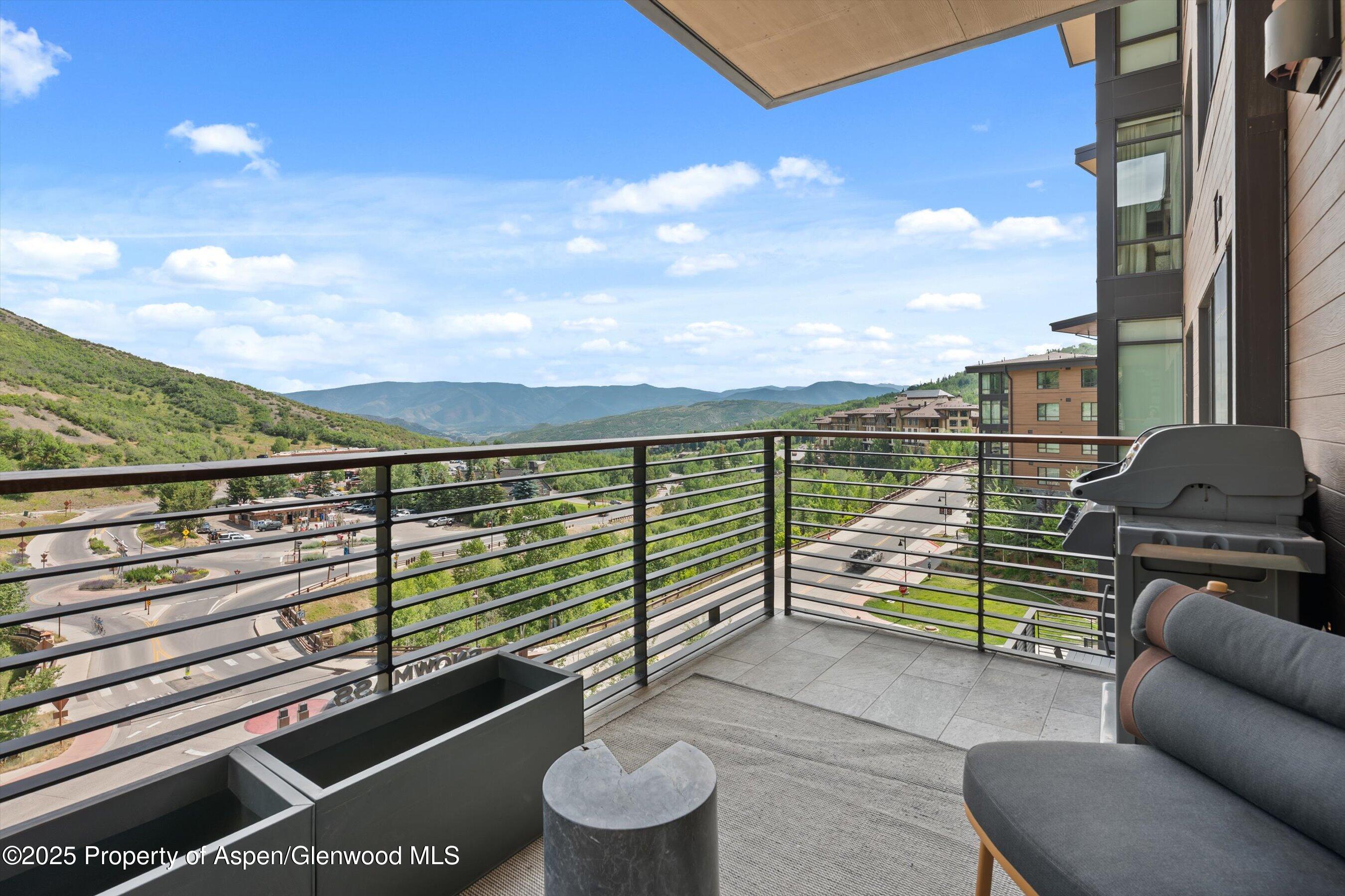 45 Wood Road, Unit 501 Snowmass Village, CO 81615 - Photo 9 of 44 a view of roof deck with couches and wooden floor