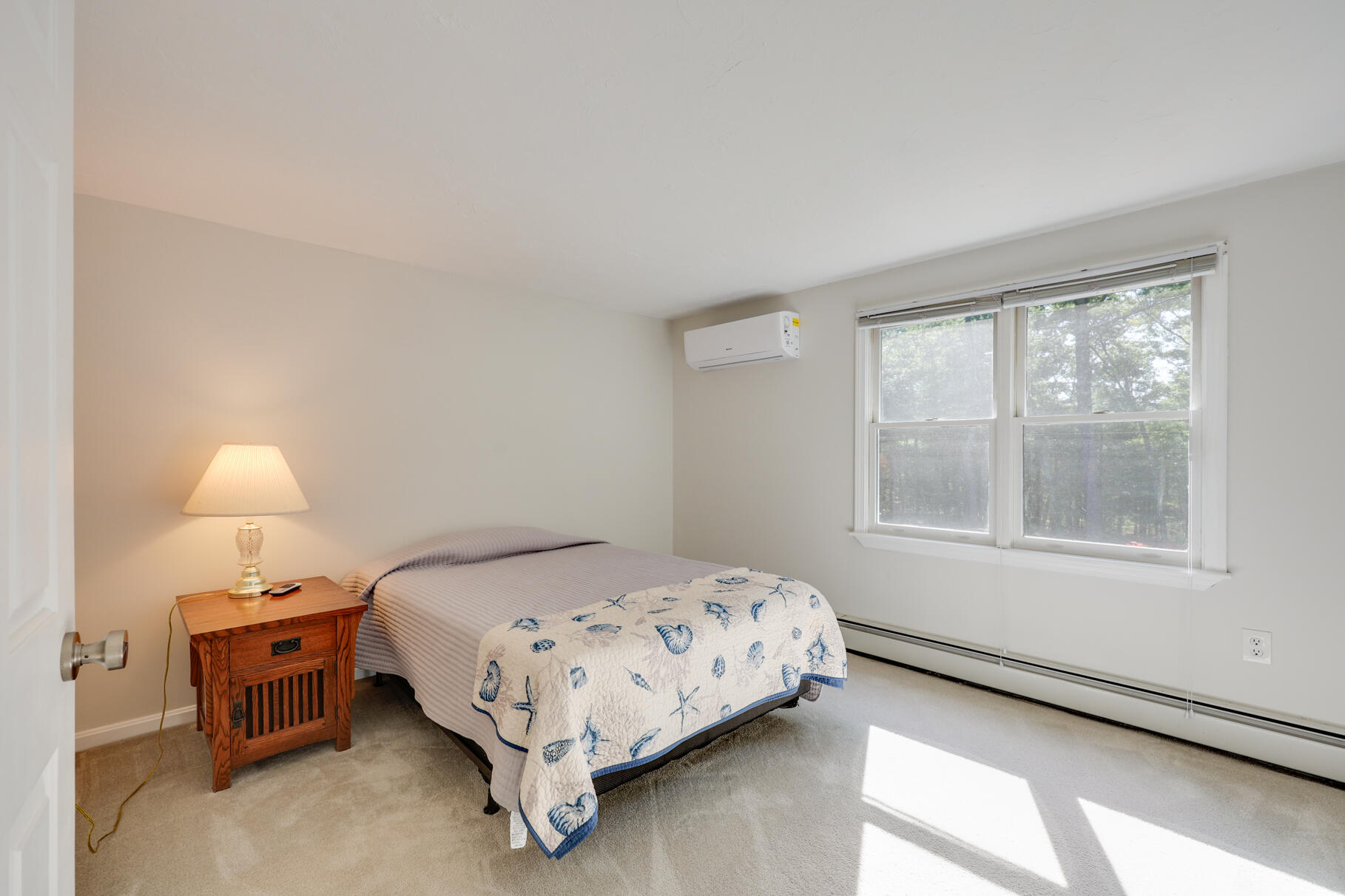7 Yearling Run Road Buzzards Bay, MA 02532 - Photo 25 of 55 a bedroom with a bed and a lamp on dresser