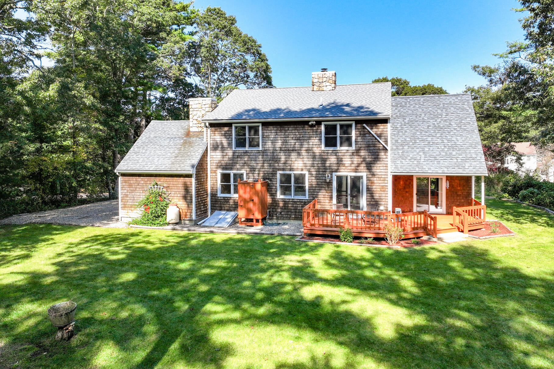 7 Yearling Run Road Buzzards Bay, MA 02532 - Photo 50 of 55 a view of a house with a yard porch and sitting area