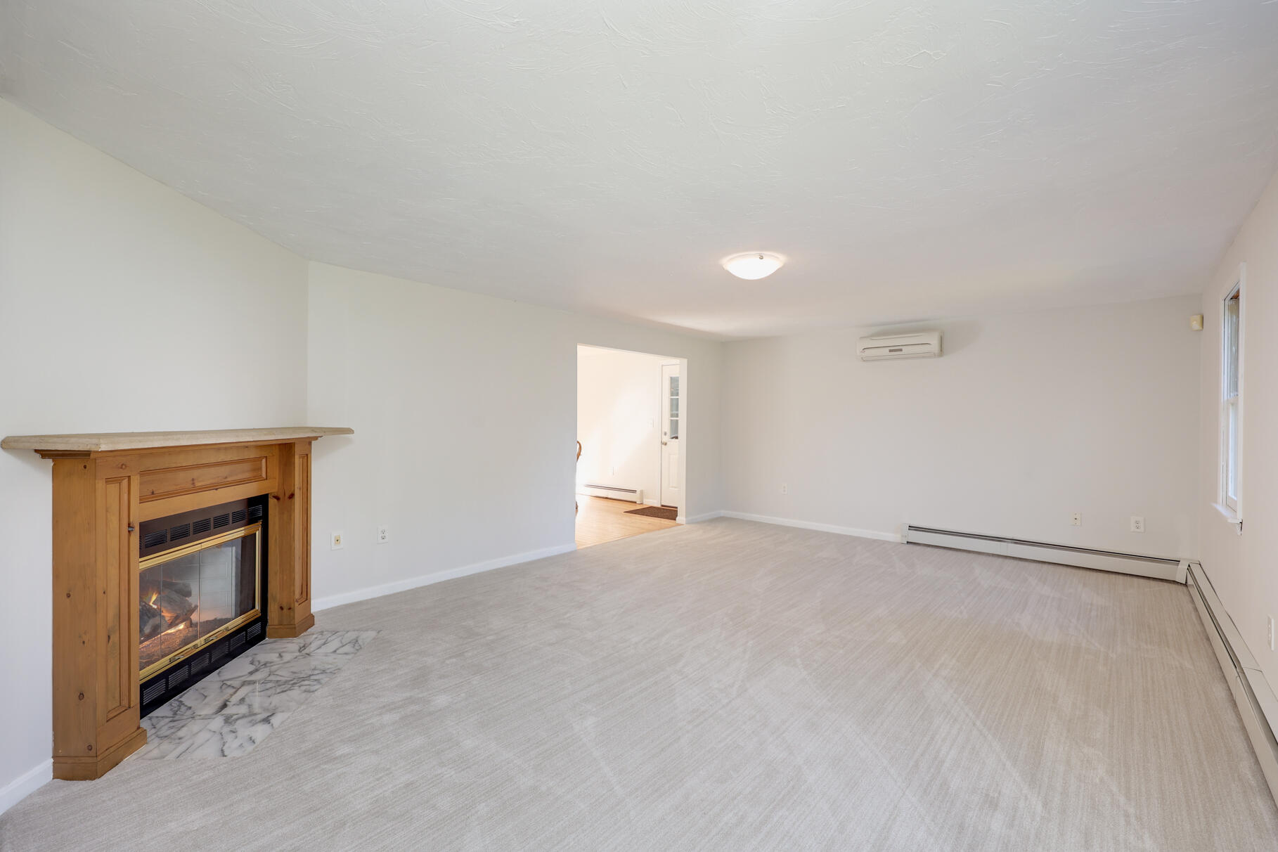 7 Yearling Run Road Buzzards Bay, MA 02532 - Photo 6 of 55 a view of empty room with a fireplace