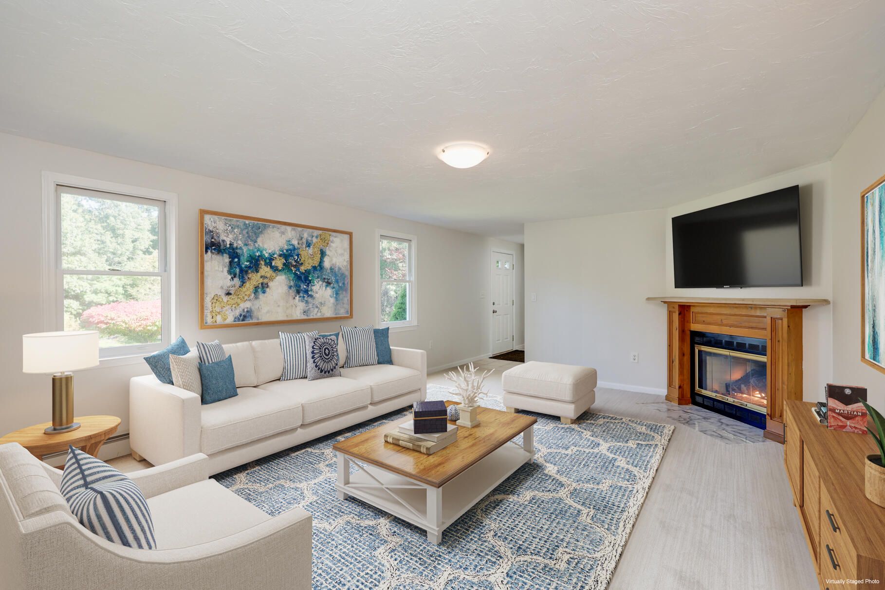 7 Yearling Run Road Buzzards Bay, MA 02532 - Photo 7 of 55 a living room with furniture a flat screen tv and a fireplace